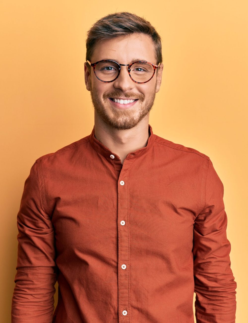 Handsome caucasian man wearing casual clothes and glasses with a happy and cool smile on face. lucky person.