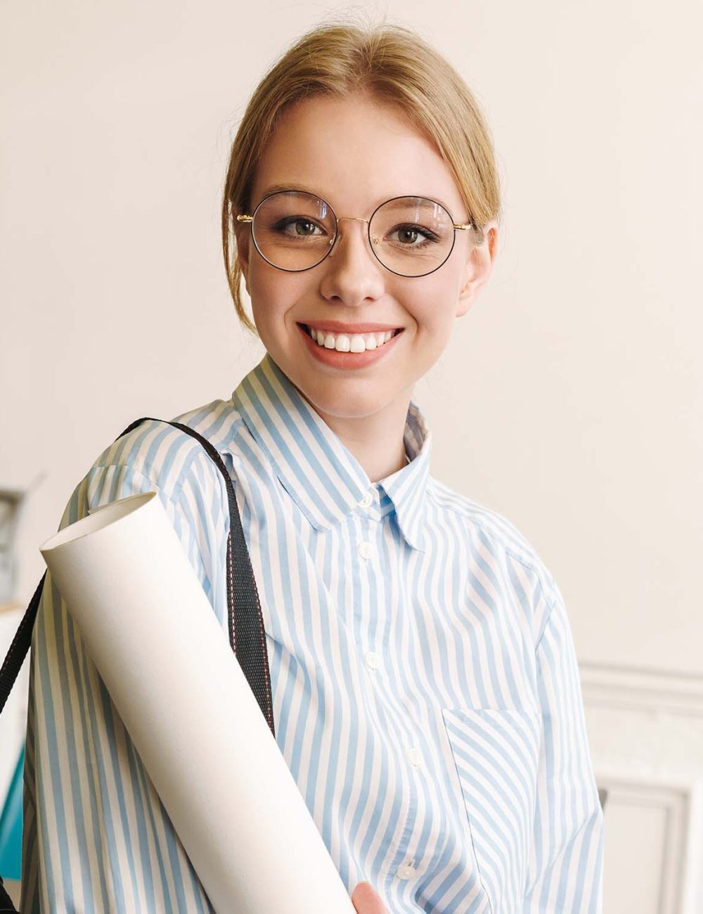 photo-of-smiling-blonde-woman-architect-posing-wit-LNWAUDT.jpg